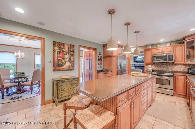 a bathroom with a sink a toilet and a window