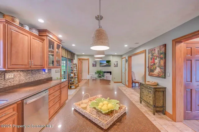 a bedroom with a large bed and a wooden floor