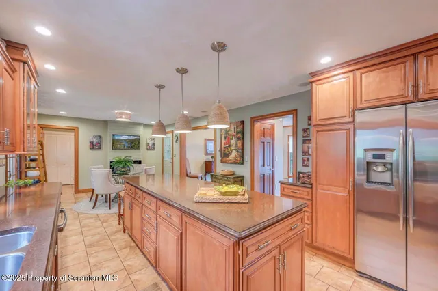 a large bedroom with a bed and a dresser