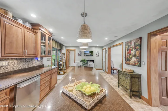 a bedroom with a large bed and a dresser