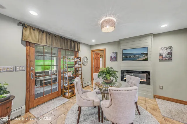 a spacious bathroom with a granite countertop sink mirror and vanity