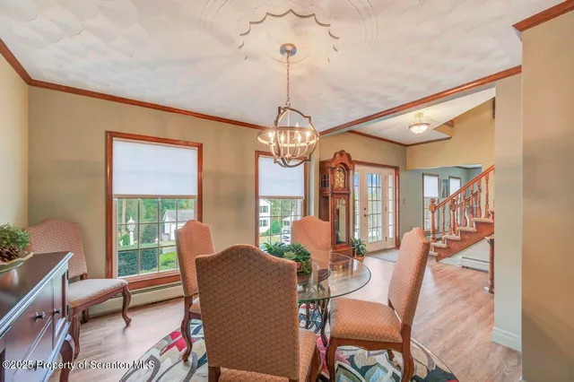 a view of a hallway with wooden floor and a bookshelf