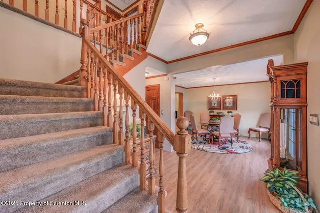 a living room with patio furniture and a garden