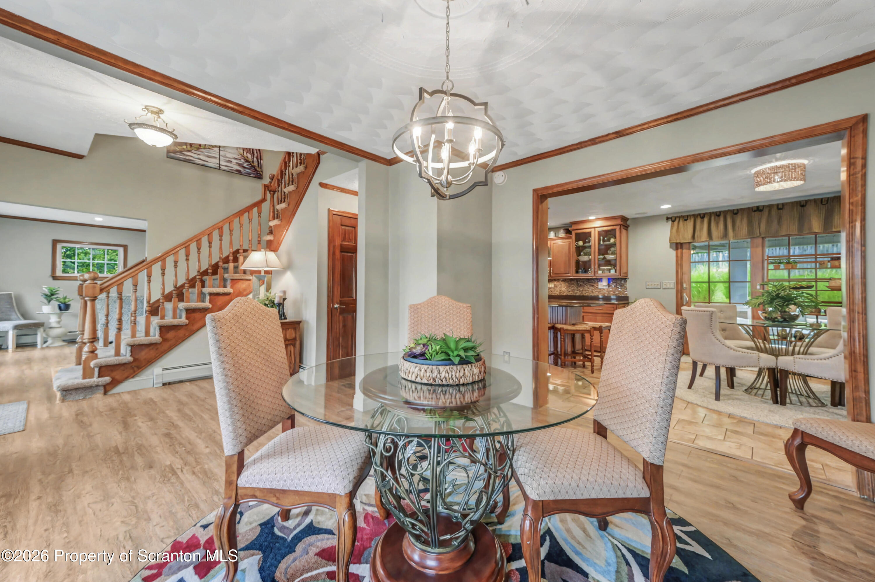 317 Bailey Street Clarks Summit, PA 18411 - Photo 42 of 95 a view of a dining room with furniture window and wooden floor