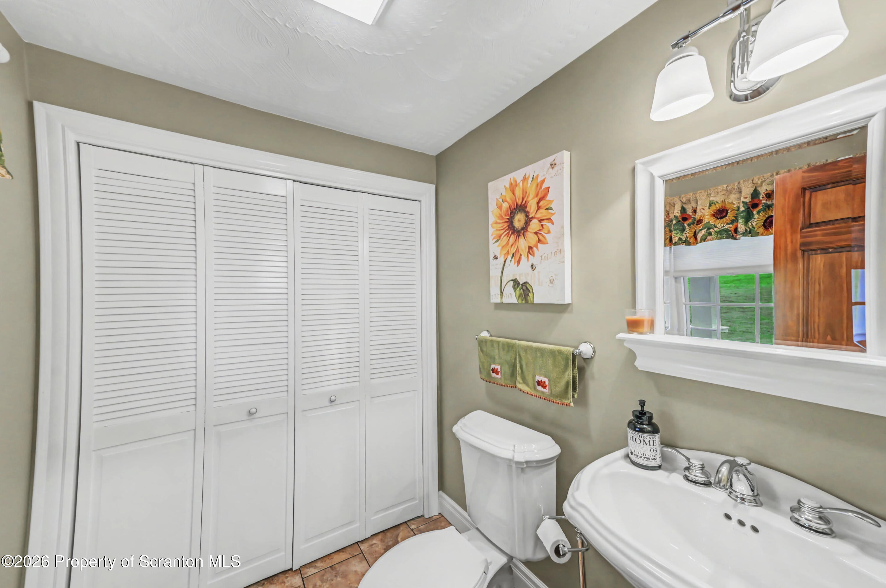 317 Bailey Street Clarks Summit, PA 18411 - Photo 45 of 95 a bathroom with a sink a toilet and shower