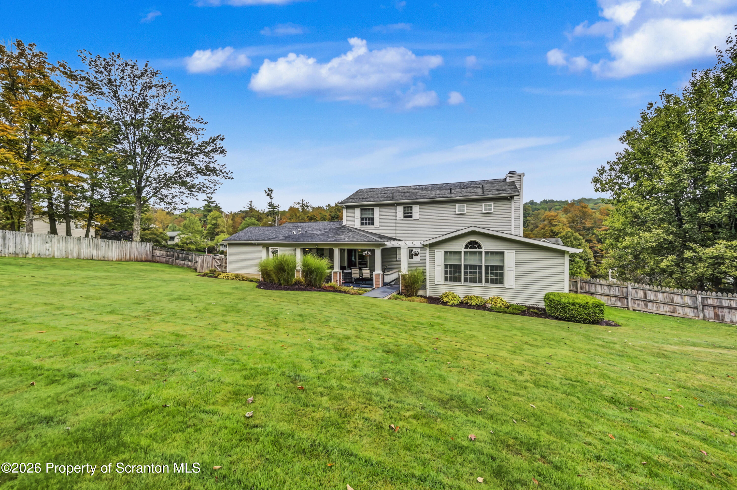 317 Bailey Street Clarks Summit, PA 18411 - Photo 5 of 95 a view of a house with a big yard and large trees