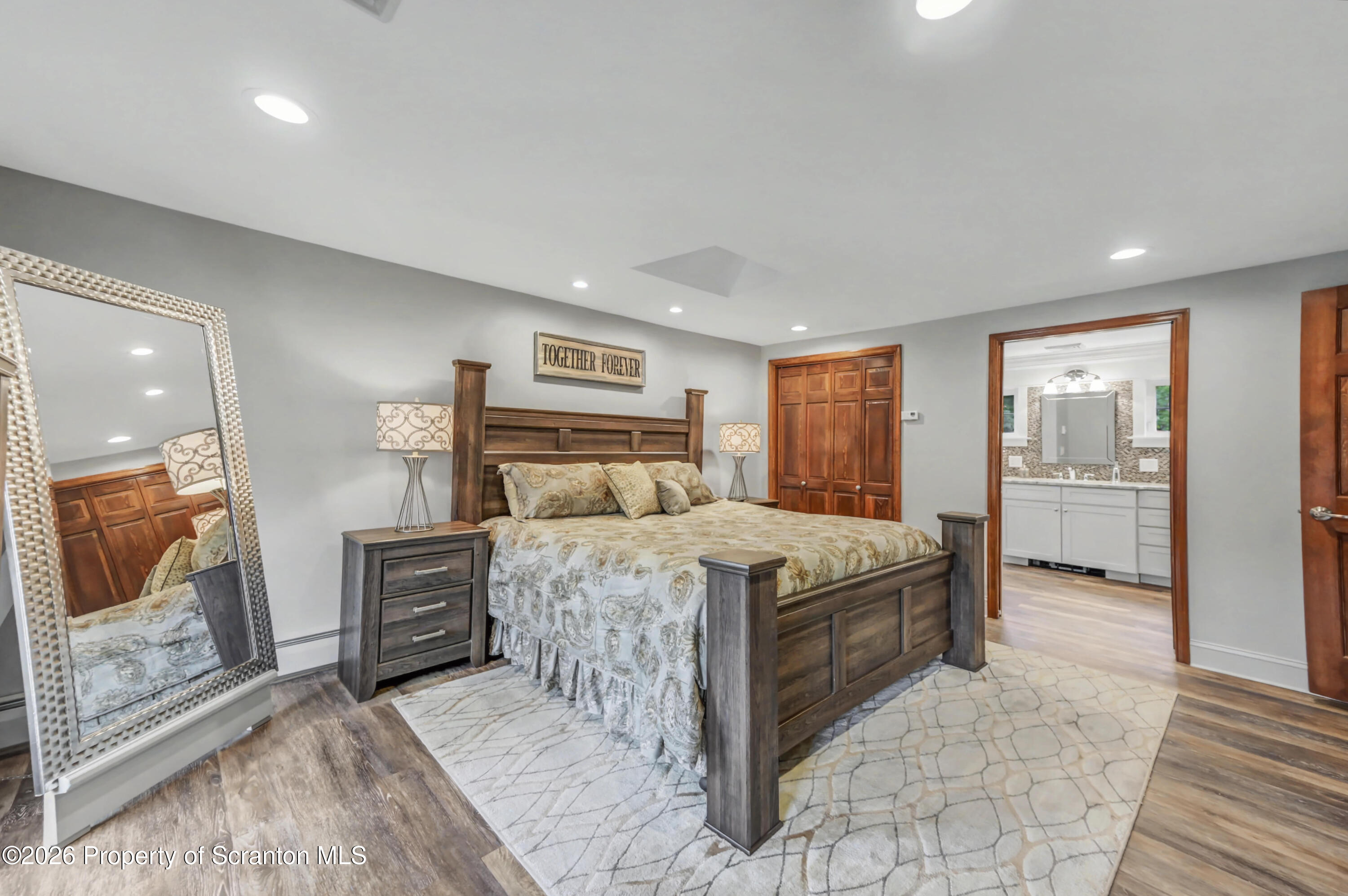 317 Bailey Street Clarks Summit, PA 18411 - Photo 56 of 95 a bedroom with a large bed and a view of bathroom