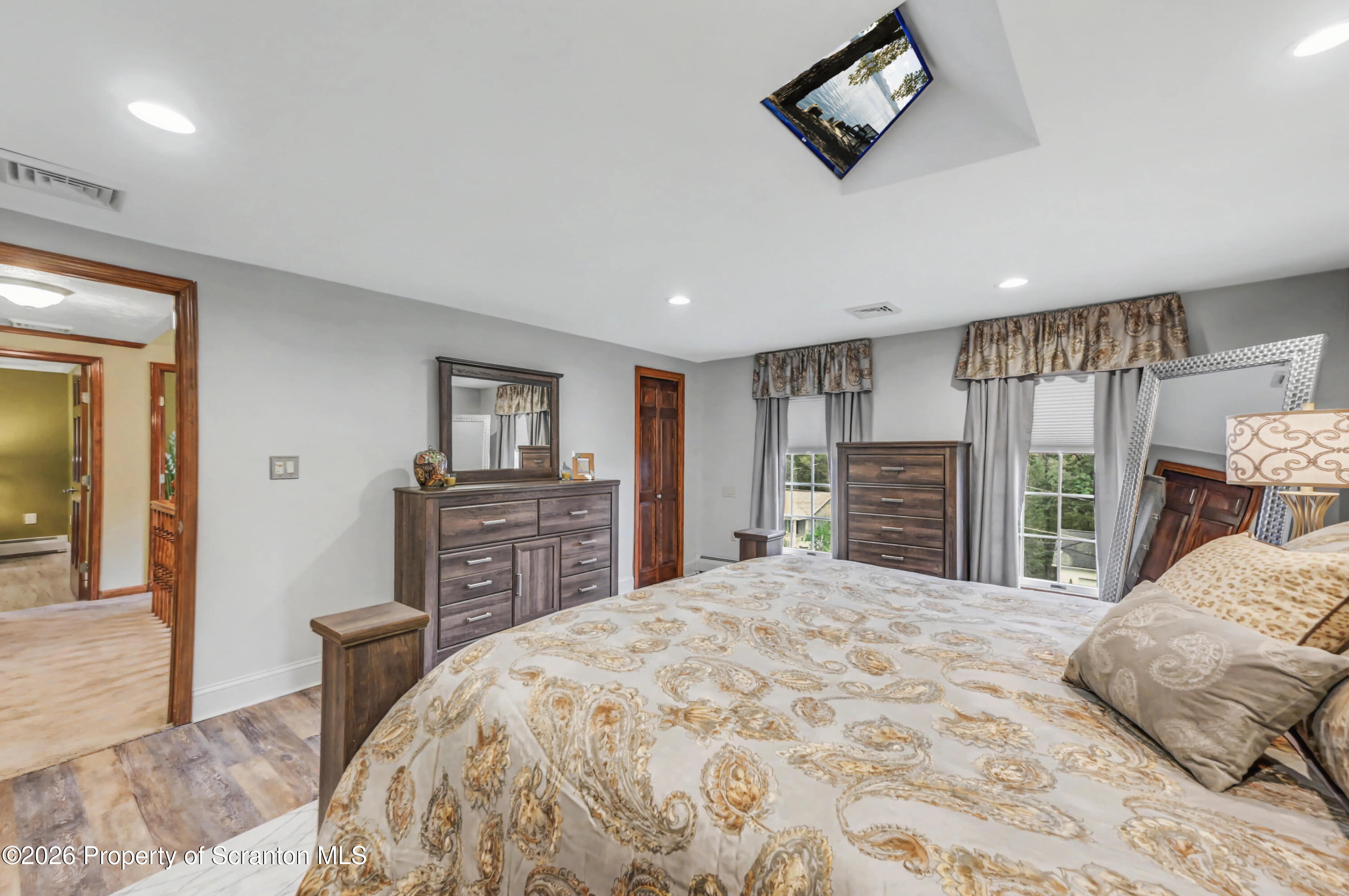 317 Bailey Street Clarks Summit, PA 18411 - Photo 58 of 95 a bedroom with a large bed and a tv