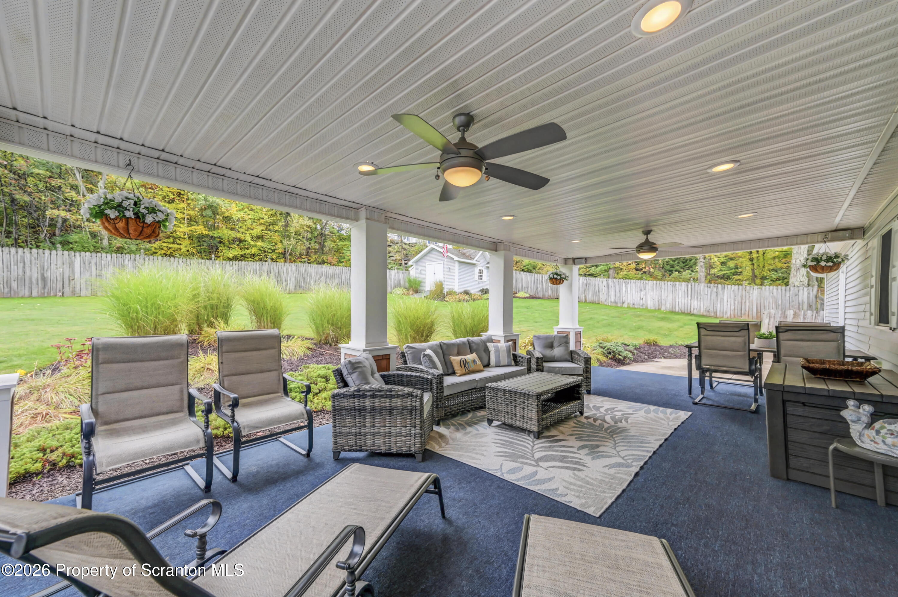 317 Bailey Street Clarks Summit, PA 18411 - Photo 6 of 95 a living room with patio furniture and a garden