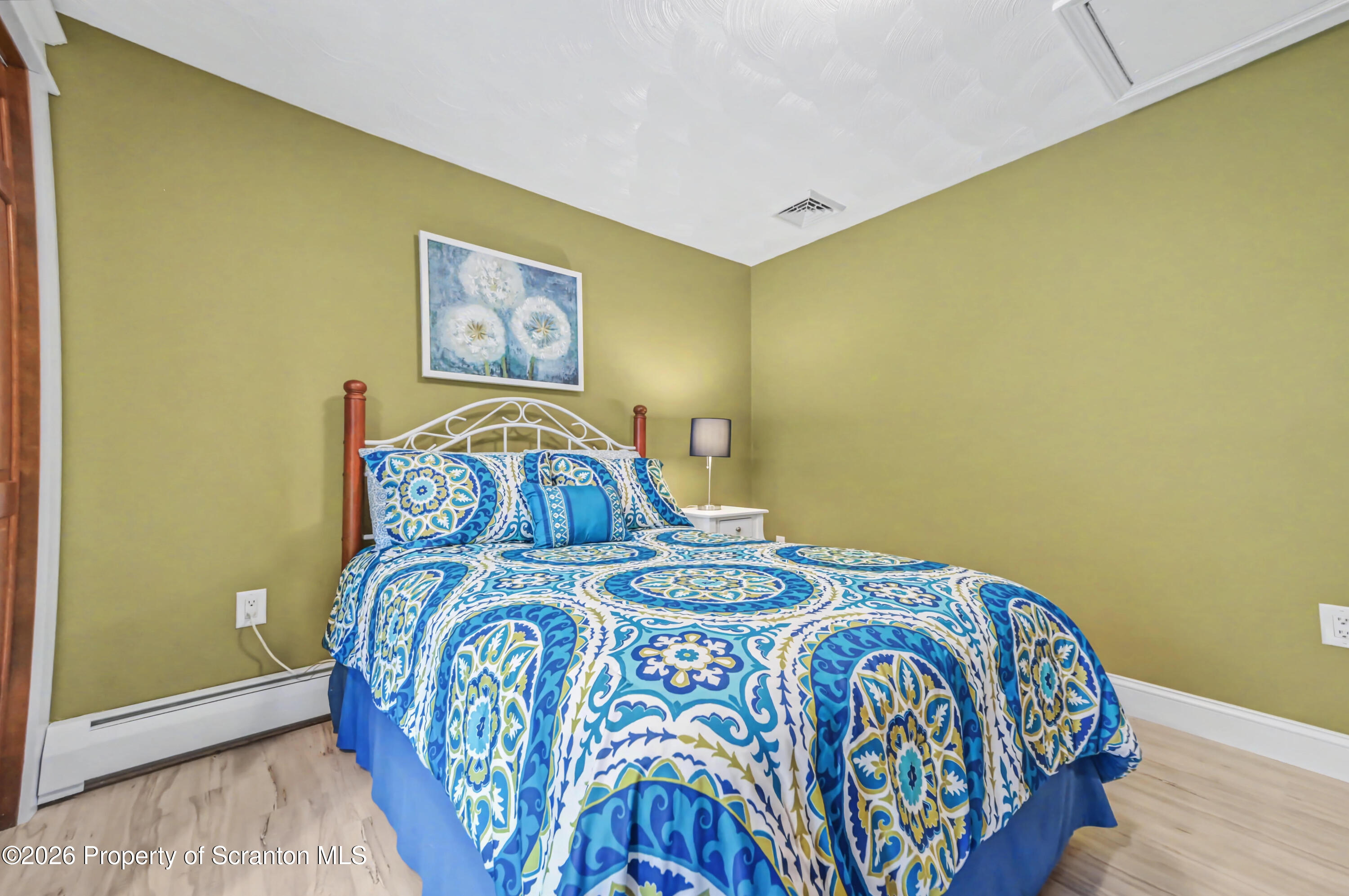 317 Bailey Street Clarks Summit, PA 18411 - Photo 64 of 95 a bedroom with a bed and a table in it