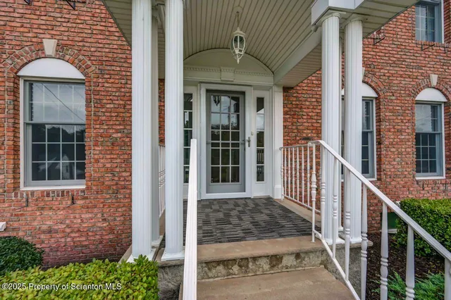 a living room with furniture fireplace and flat screen tv