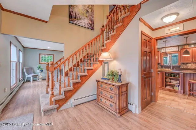 a living room with furniture large window and a table