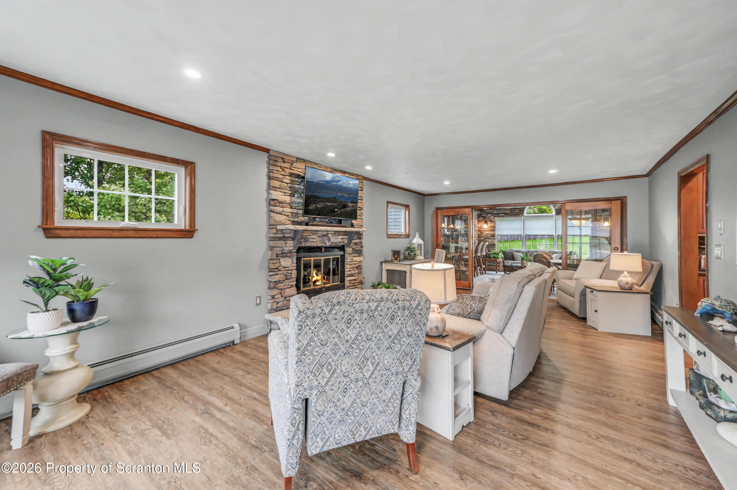 317 Bailey Street Clarks Summit, PA 18411 - Photo 10 of 95 a living room with furniture and a wooden floor