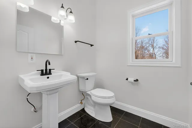 a spacious bedroom with a bed and a couch