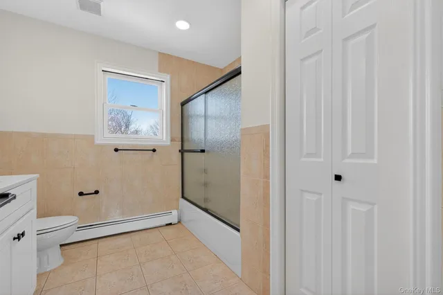 a bathroom with a tub and a shower