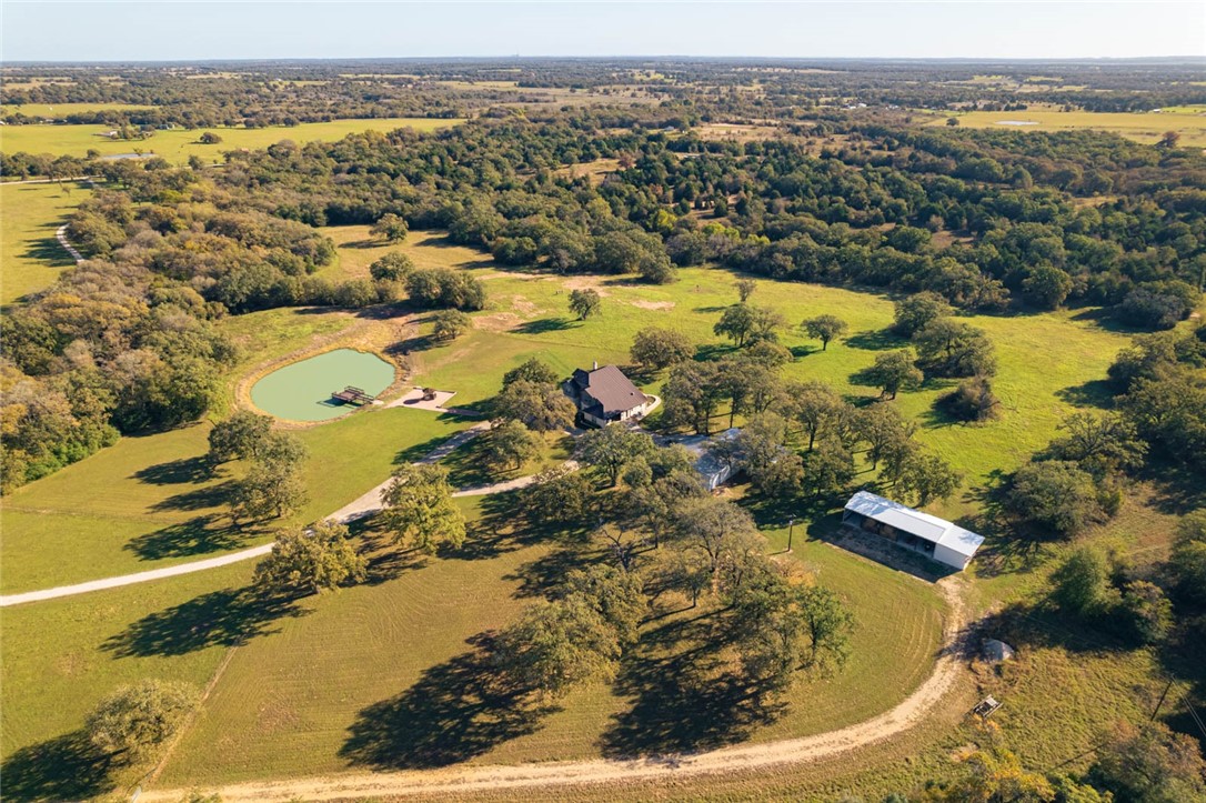 an aerial view of residential houses with outdoor space