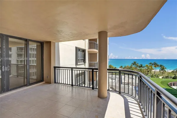 a view of a balcony with chairs