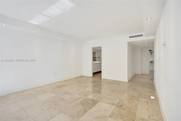 an empty room with white walls