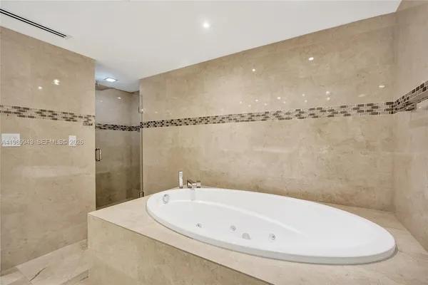 a bathroom with a toilet a sink and a shower