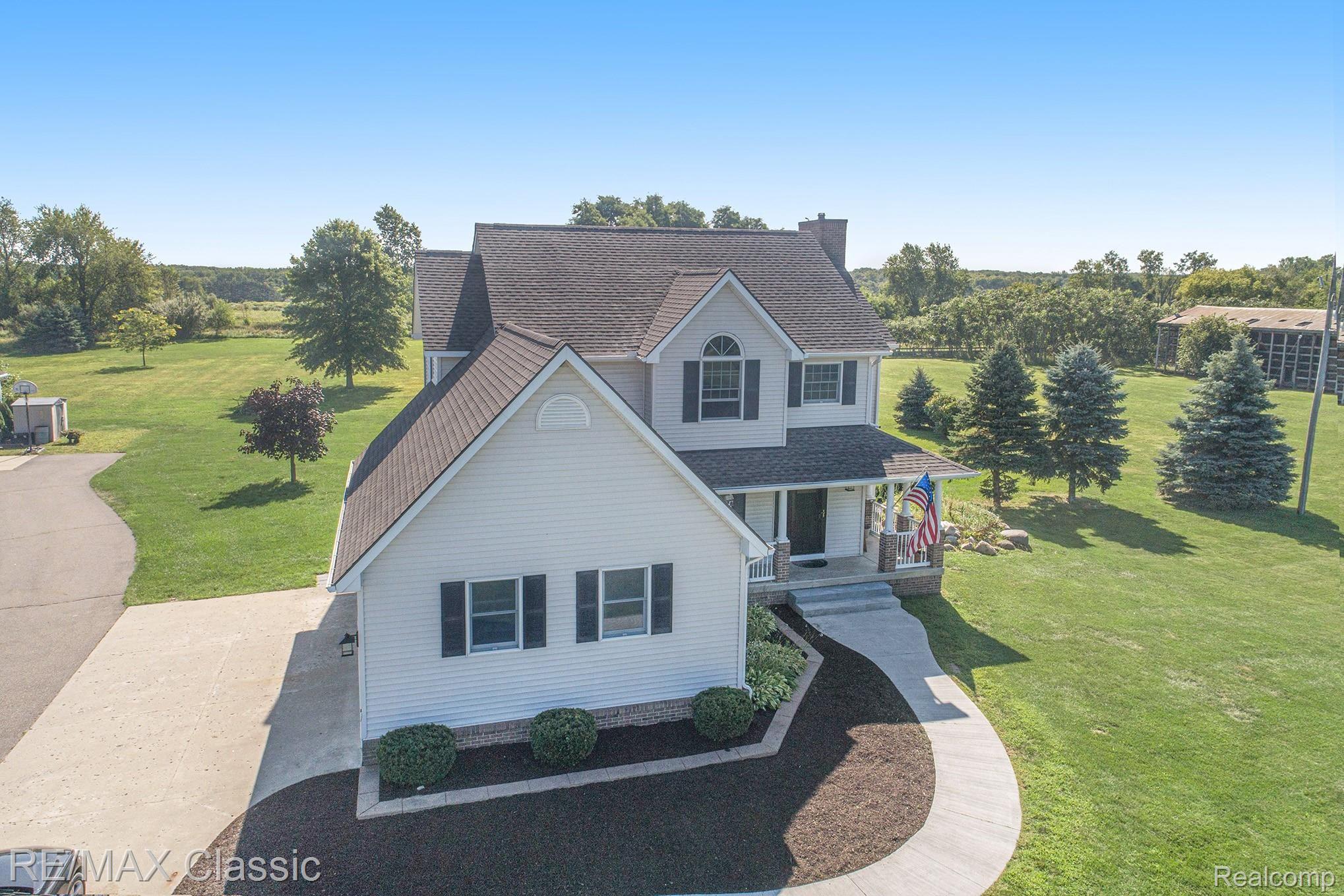 8070 Oak Grove Road Howell, MI 48855 - Photo 2 of 34 New cement walk way and fresh landscaping