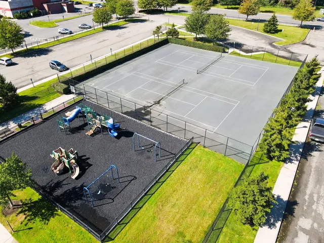 an aerial view of a house with a swimming pool