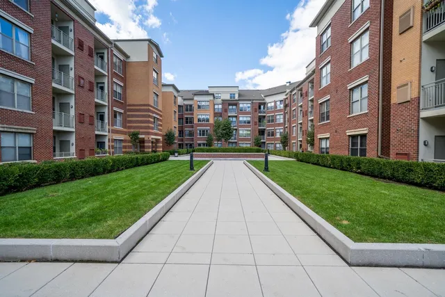 a view of buildings with yard