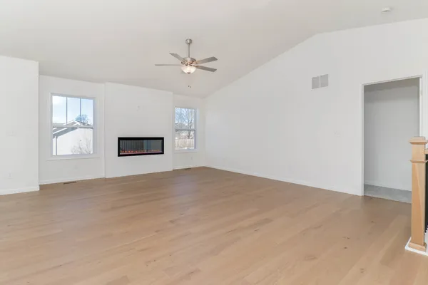 a view of empty room with a fireplace