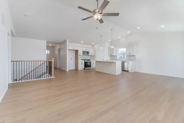 a view of a kitchen with a sink and a stove top oven