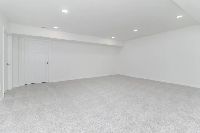 a bathroom with a sink a mirror and a shower