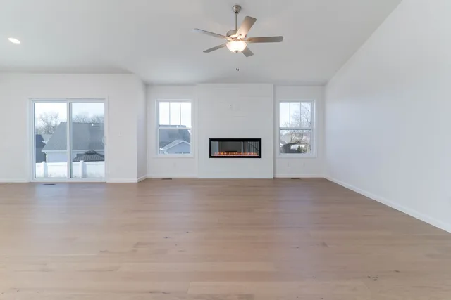 a view of a livingroom with a ceiling fan and window
