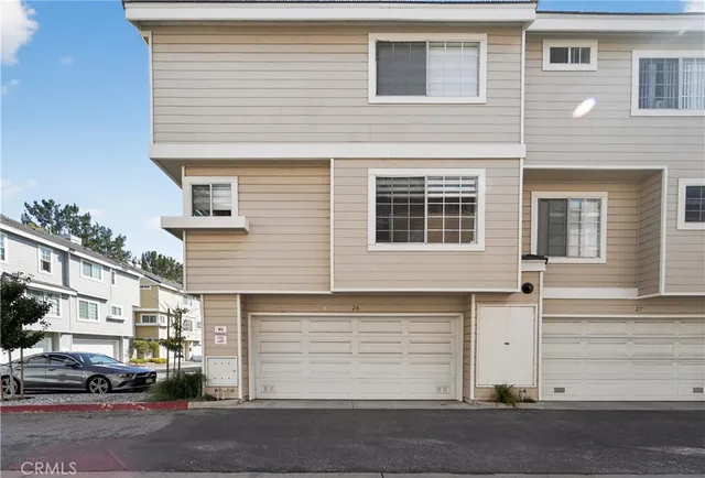 a view of a house with a street