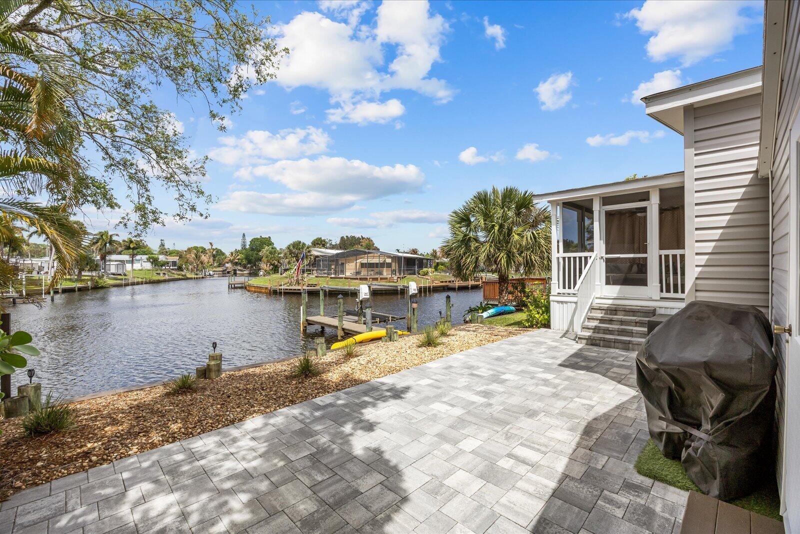 121 Southeast Paradise Place Stuart, FL 34997 - Photo 25 of 33 a view of a swimming pool with a lounge chair
