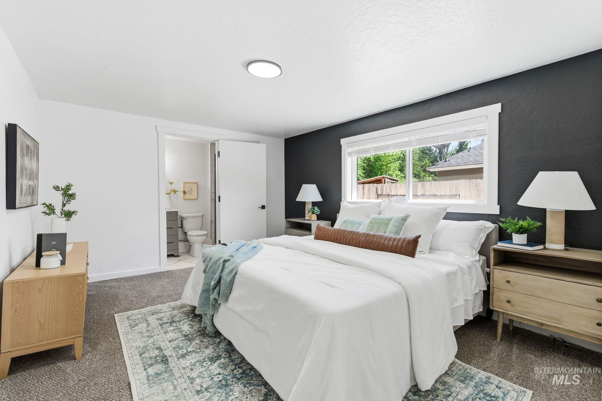 2224 Rachel Circle Boise, ID 83706 - Photo 29 of 50 Bedroom featuring a dark accent wall, recessed lighting, and a window with white trim