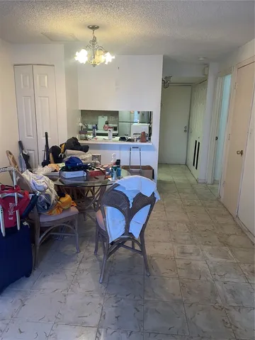 a kitchen with a sink a stove and cabinets