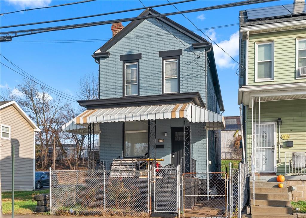 310 5th Avenue Braddock, PA 15104 - Photo 1 of 26 a view of a house with a porch