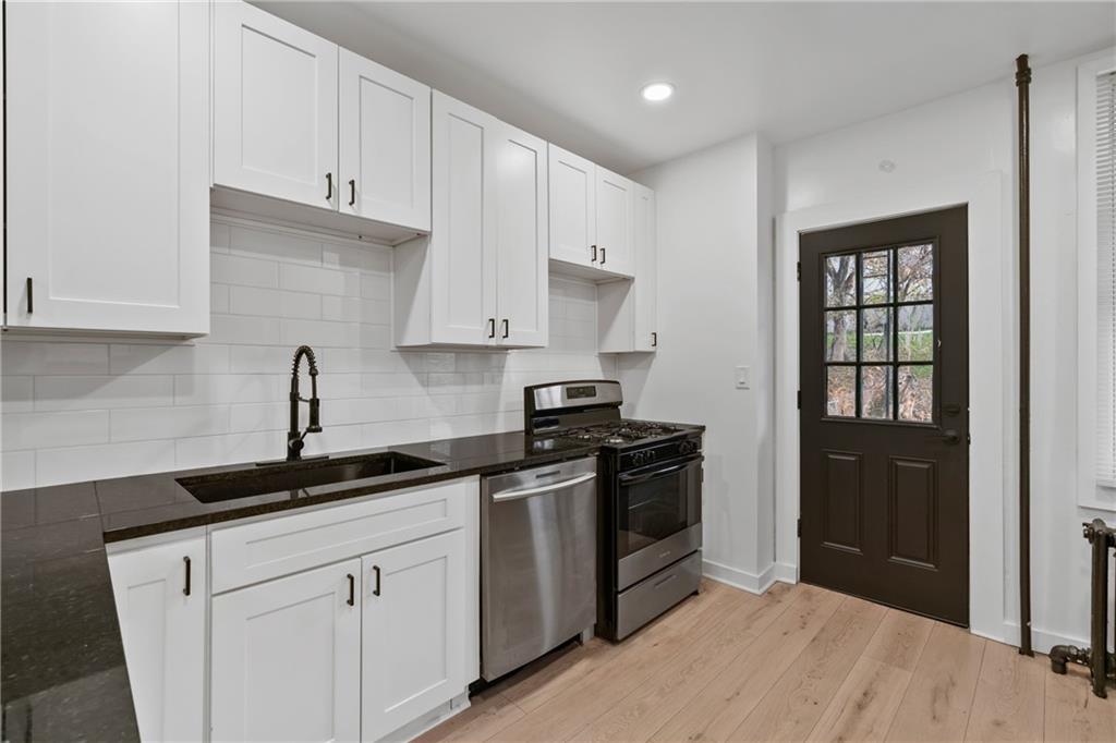 310 5th Avenue Braddock, PA 15104 - Photo 12 of 26 a kitchen with a sink and cabinets