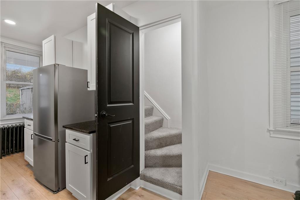 310 5th Avenue Braddock, PA 15104 - Photo 14 of 26 a kitchen with metallic refrigerator freezer and a dishwasher