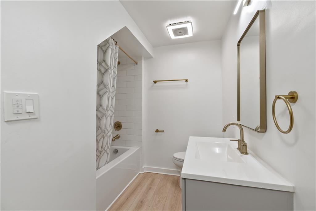 310 5th Avenue Braddock, PA 15104 - Photo 15 of 26 a bathroom with a sink and a mirror