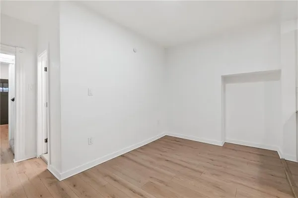 a view of wooden floor in an empty room