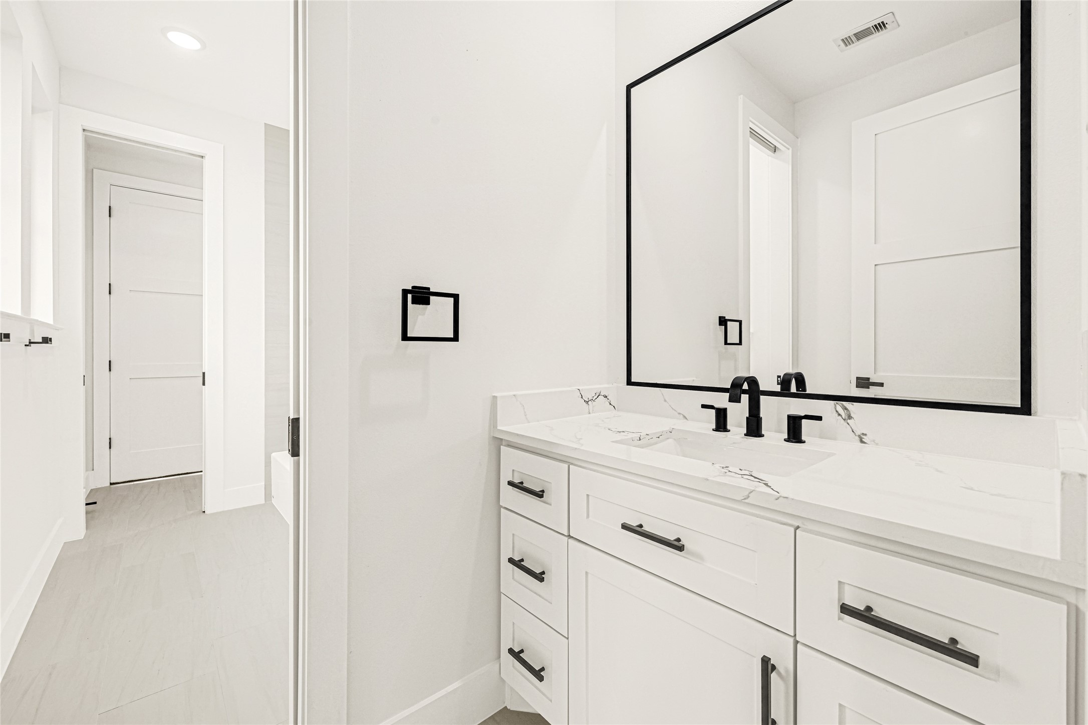 16915 Hamill Drive Rosharon, TX 77583 - Photo 31 of 47 a bathroom with a double vanity sink and mirror