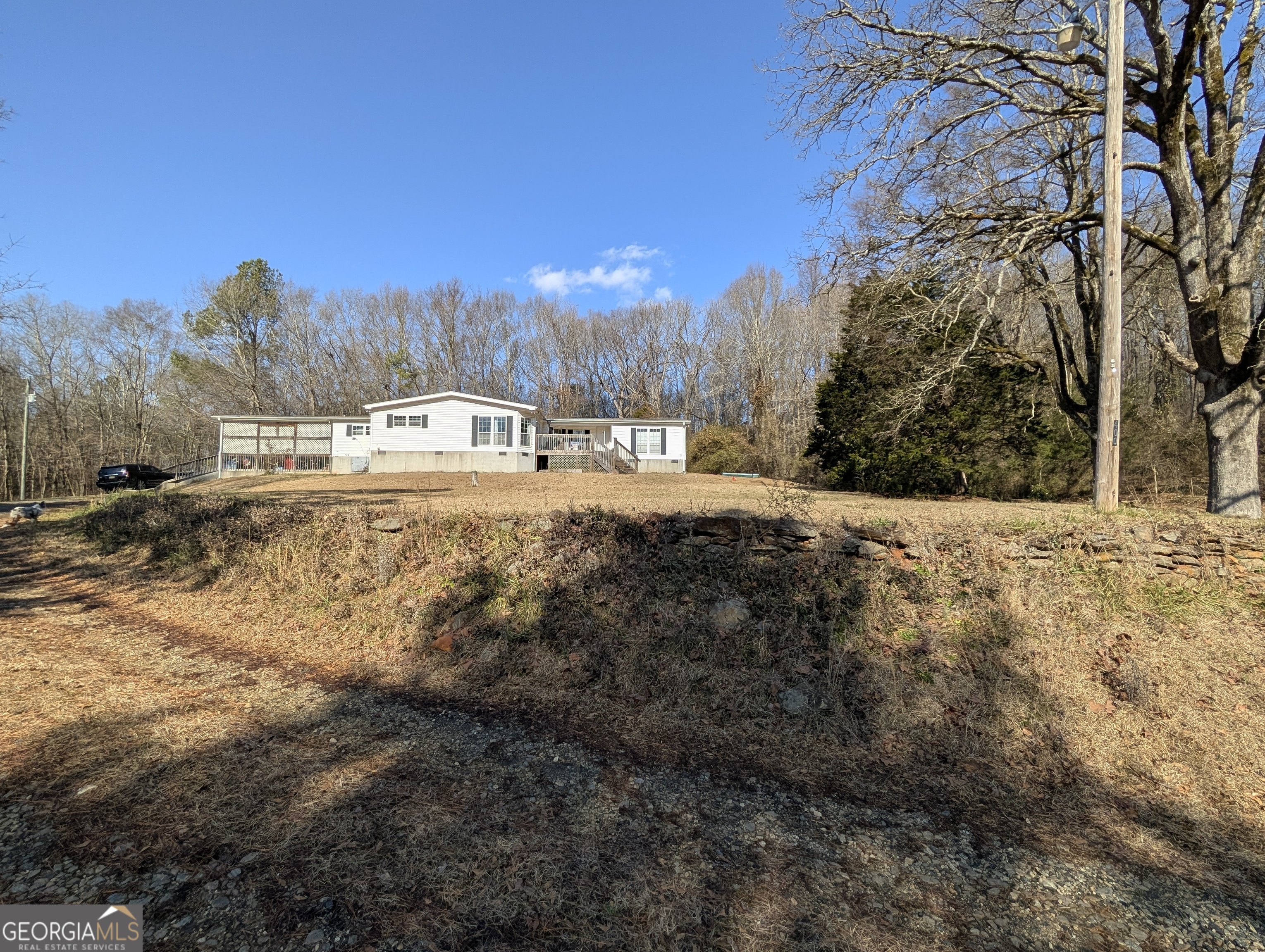 400 New Bethel Road Carnesville, GA 30521 - Photo 1 of 1 a view of large yard with a house