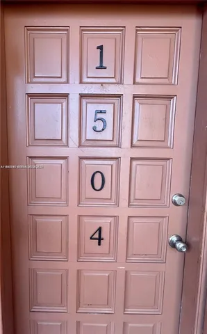 a living room with furniture and chandelier