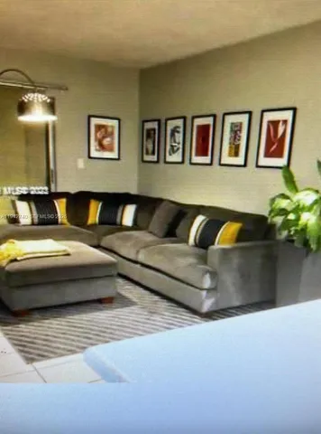 a metallic refrigerator freezer sitting in a kitchen