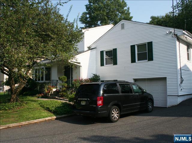 82 Heatherhill Road Cresskill, NJ 07626 - Photo 3 of 9 a view of a car in front of a house