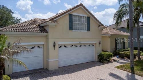 65 Calliope Street Ocoee, FL 34761 - Photo 58 of 60 a front view of a house with garage