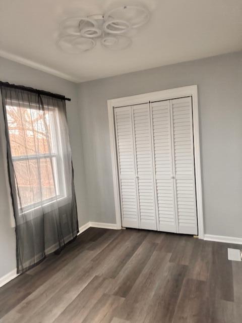 940 Idaho Street Gary, IN 46403 - Photo 14 of 32 an empty room with wooden floor and windows