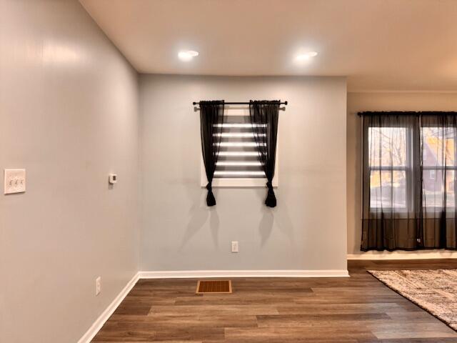 940 Idaho Street Gary, IN 46403 - Photo 6 of 32 an empty room with wooden floor and windows