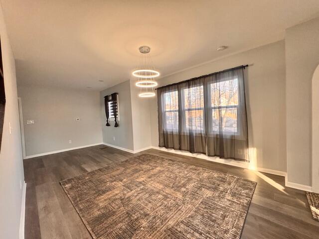 940 Idaho Street Gary, IN 46403 - Photo 8 of 32 a view of an empty room with wooden floor and a window