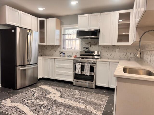 940 Idaho Street Gary, IN 46403 - Photo 9 of 32 a kitchen with a sink a stove and refrigerator
