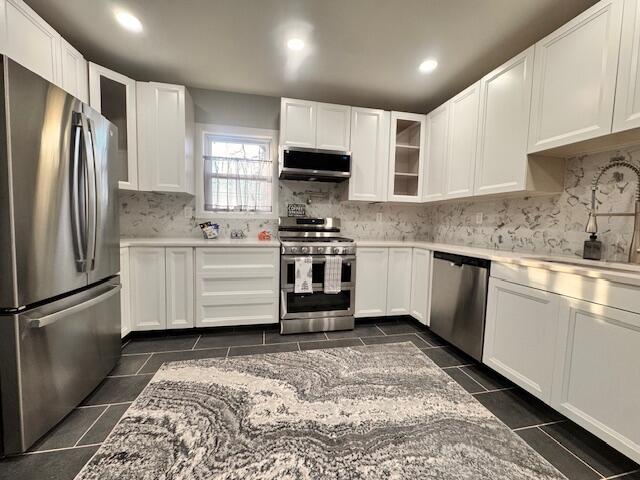 940 Idaho Street Gary, IN 46403 - Photo 10 of 32 a kitchen with stainless steel appliances granite countertop a stove a sink and a refrigerator